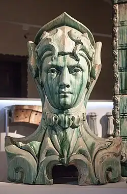 Bust decorating the balconies of 29 avenue Rapp, Paris, by Alexandre Bigot and Jean-Baptiste Larrivé&nbsp;[fr] (1901)