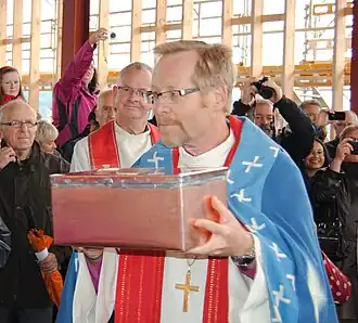 Bishop with foundation stone