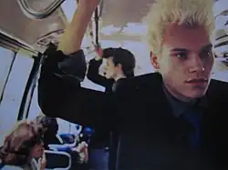 Mastbaum standing in a train car