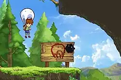 In-game screenshot of the Boy using the Blob as a parachute. The two are hovering over a ledge in a forested area with a large sign beneath them indicating the player should use the parachute transformation.