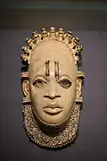Pendant mask; by artists of the Edo people (Nigeria); 16th century (?); ivory and iron; height: 24.5&nbsp;cm; British Museum, London[106]