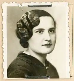 B&W portrait photo of a young woman with short wavy hair.