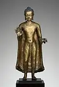 Buddha offering protection; late 6th–early 7th century; copper alloy; height: 47&nbsp;cm, width: 15.6&nbsp;cm, diameter: 14.3&nbsp;cm; from India (probably Bihar / Later Gupta dynasty); Metropolitan Museum of Art