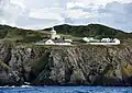 The lighthouse compound viewed from the sea.