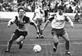 Gütschow (left) chases the ball in a 1990 match against Chemnitzer FC.