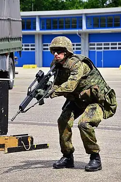A German soldier holding his G36