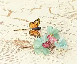 Image 80Butterfly and floral clips, worn in the mid- and late 1990s. (from 1990s in fashion)