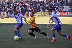 Duel between players of CE Europa and UE Sant Andreu