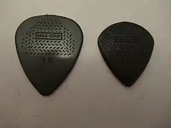 Dunlop "Max-Grip" carbon fiber guitar picks. Sizes 1mm and Jazz III.