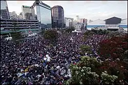 Photo of large crowd in a park.