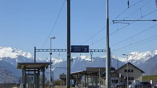 Canopy-covered platforms with mountains in the background