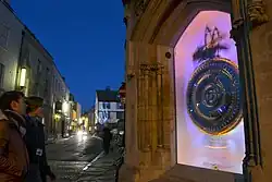 The Corpus Clock, looking east down Bene't Street at night