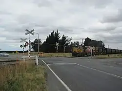Coal train approaching level crossing
