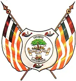 Coat of Arms depicting a covered wagon, a tree and a lion