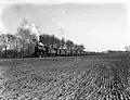 A steam locomotive from the series 3400 of the N.S. with an oil train near Dalfsen. (1951)