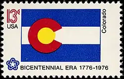 The Colorado state flag as depicted in the 1976 bicentennial postage stamp series.