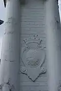 Crest of the Singapore Municipal Commission on a gatepost of the former Bidadari Cemetery