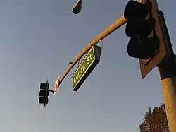 Internally illuminated mast-mounted street sign in Whittier, California