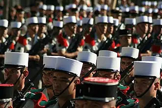 Legionnaires of the French Military with FAMAS rifles and fixed bayonets.