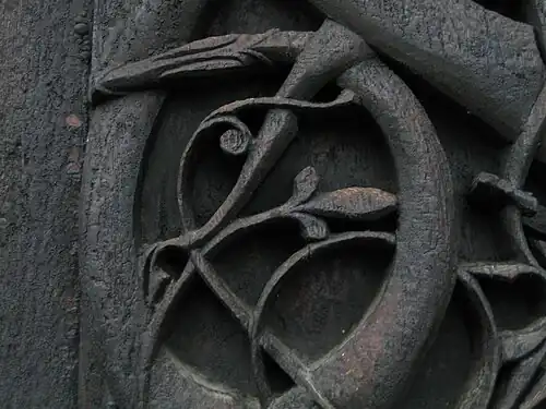 Detail of carving on the left jamb of the north door