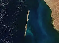 thin, vertically-stretched island, with continental shore appearing on the right