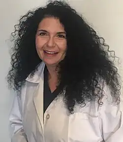 Dr. Sue Sisley in a lab coat