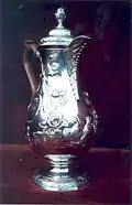 Silver hot water jug, Dublin c1770, using a coffee-pot shape with a higher base.