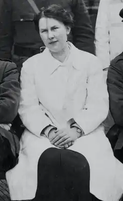 Black and white photograph of Dulcie Mary Pillers, seated front row, next to Ernest William Hey&nbsp;Groves (not shown). Taken from a group photograph of the medical staff at the hospital near the end of World War I.