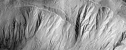 Gullies in a crater, as seen by HiRISE under HiWish program This image was named HiRISE Picture of the Day for June 25, 2024.