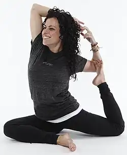 Businesses that sell yoga-related products have used Eka Pada Rajakapotasana, as here by Lululemon in 2011.