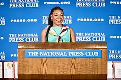 Christine Emba accepting the Nell Minow Award for Cultural Criticism at the National Press Club in 2024