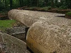 An image of the outside of the Führungsbunker, showing its round shape and smooth stone surface