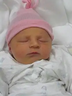 In the United States and Europe, baby girls are often dressed in pink and white.