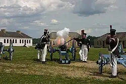 Minnesota Historical Society Historic Interpreters firing a cannon at the fort.