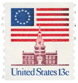 1975 13¢ stamp features the Betsy Ross flag behind Independence Hall