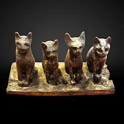 Four cats; 664–332 BC; wood; height: 14&nbsp;cm, width: 27&nbsp;cm; Louvre