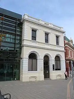 This is a photograph of the Frank Cadd Building, built in 1890, which is attached to a School of Health Sciences building