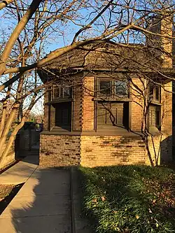 Exterior of the library as seen from Forest Avenue. The library is a small octagonal brick structure with windows at its top.
