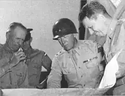 McNair confers with George Patton and others at Desert Training Center