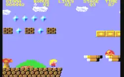 Gameplay from the Great Giana sisters. The screen capture of gameplay showcases various video game elements such as platforms, the playable character, and enemies. Text at the top of the screen displays various in-game elements such as time left, the stage and points. The color palette and colour are similar to those of the aforementioned "Super Mario Bros." game.