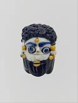 Face bead; mid-4th–3rd century BC; glass; height: 2.7&nbsp;cm; Metropolitan Museum of Art