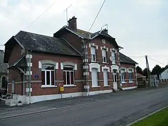 The town hall and school in Grandcourt