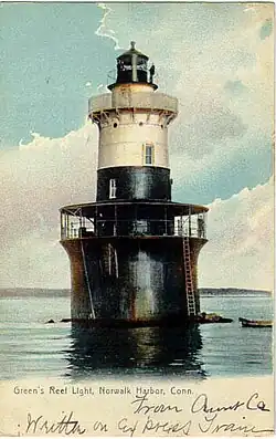 Greens Ledge Light stands in open water about 10 feet (3.0&nbsp;m) deep, about 1 km from land