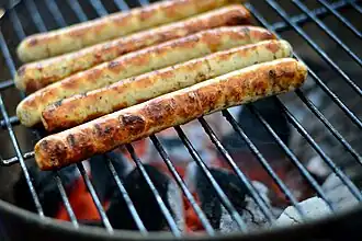 Some sausages grilling