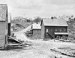A late-19th century view west from near today's Grist Mill Park. Staples Hill is in the background