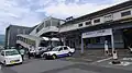The west entrance of the station in 2014. To the right is the old station building, since demolished. The sign says "Thank You, Haiki Station".