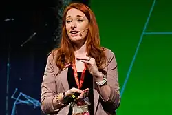 Hannah Fry publicly speaking at a conference, 2014