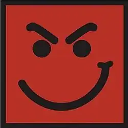 A picture of a smile with angry eyebrows on a red-orange background with black edges