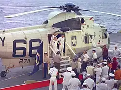 The Apollo 8 crew shown disembarking Helicopter 66 aboard USS&nbsp;Yorktown following their return to Earth