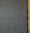 Example of the herringbone pattern, a popular choice for suits and outerwear